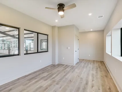 a view of hallway with a large window