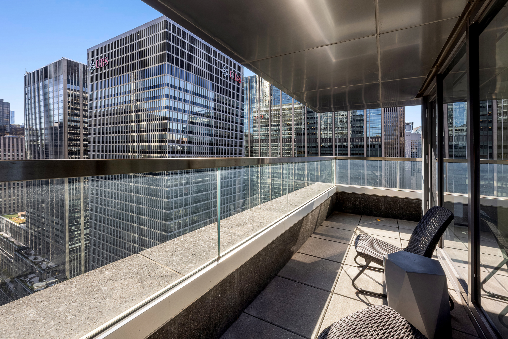 135 West 52nd Street, Unit 40A Manhattan, NY 10019 - Photo 14 of 24 a view of balcony with a potted plant