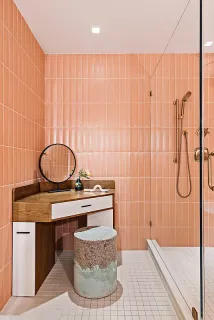 a bathroom with a granite countertop sink a toilet and shower
