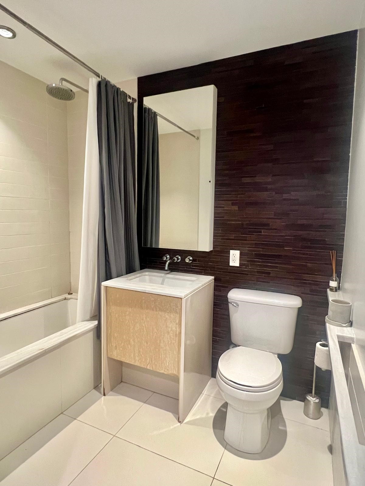 2 Northside Piers, Unit 26C Brooklyn, NY 11249 - Photo 12 of 21 a bathroom with a toilet and a shower