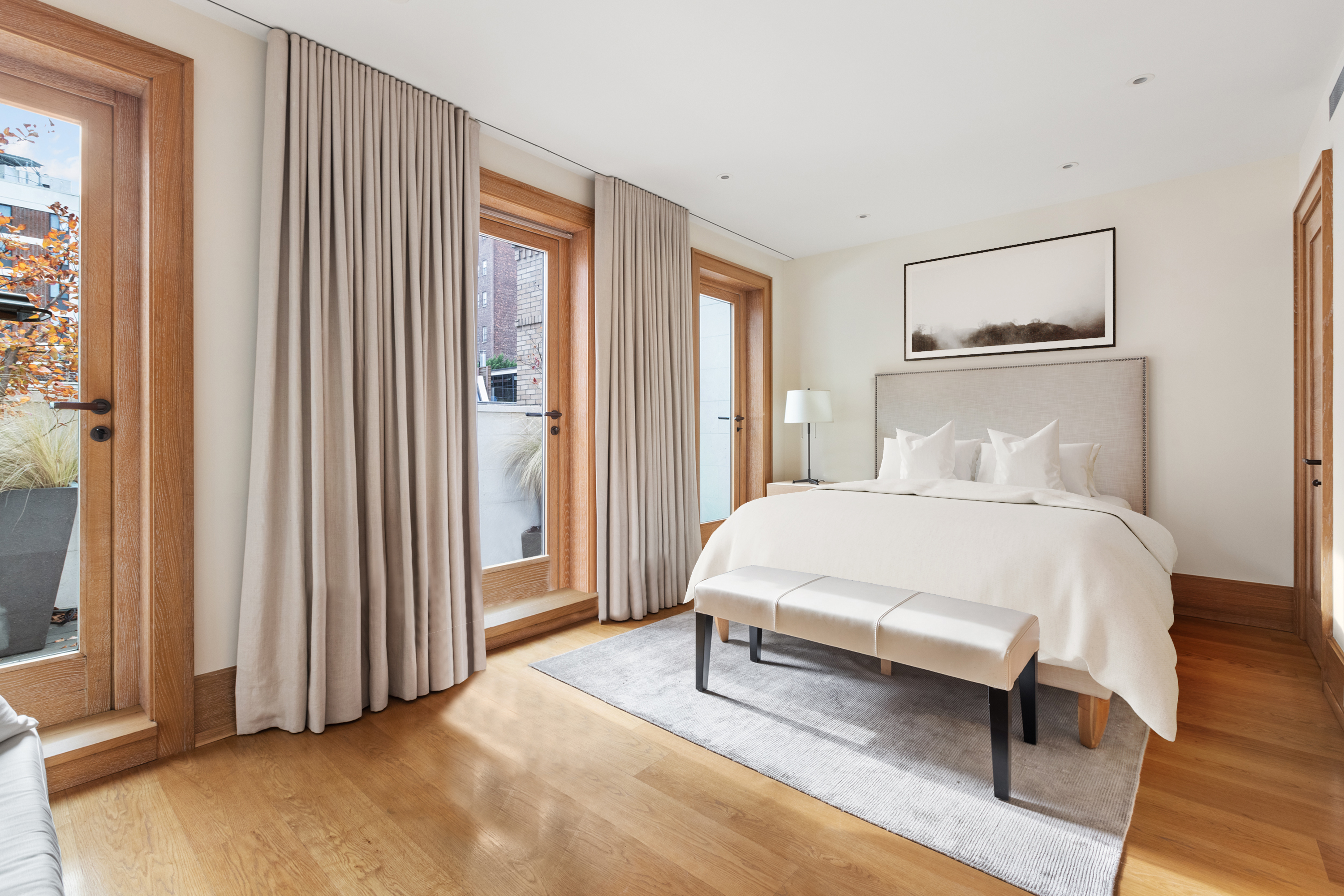 45 East 74th Street Manhattan, NY 10021 - Photo 22 of 33 a bedroom with a bed and a window