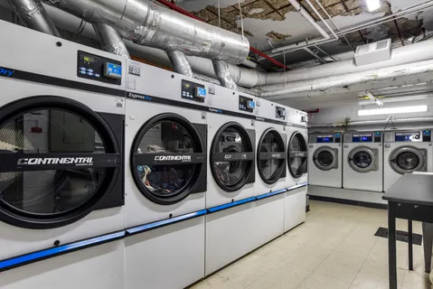 a utility room with dryer washer and dryer