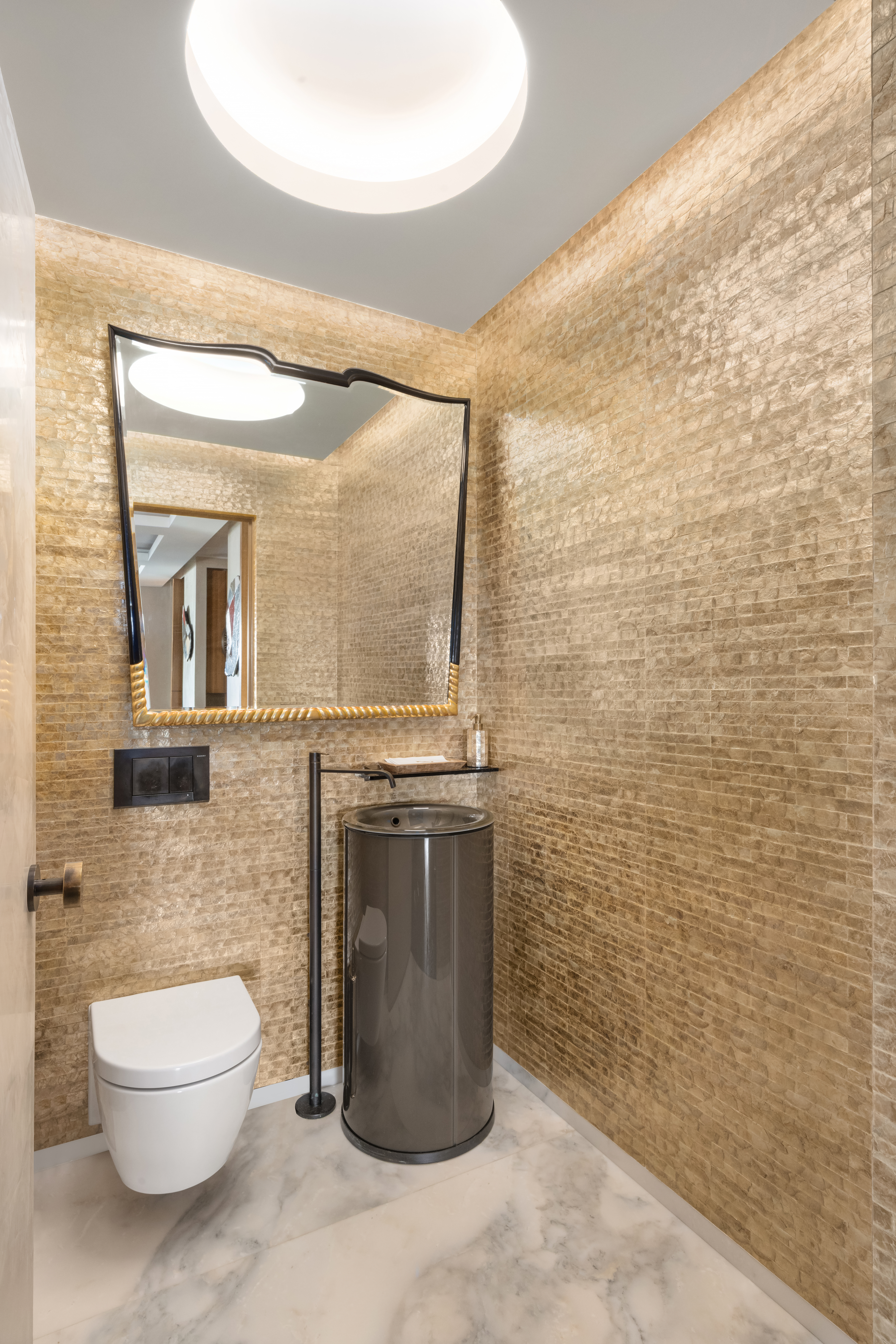 150 West 56th Street, Unit 3901 Manhattan, NY 10019 - Photo 7 of 25 a bathroom with a toilet sink and mirror