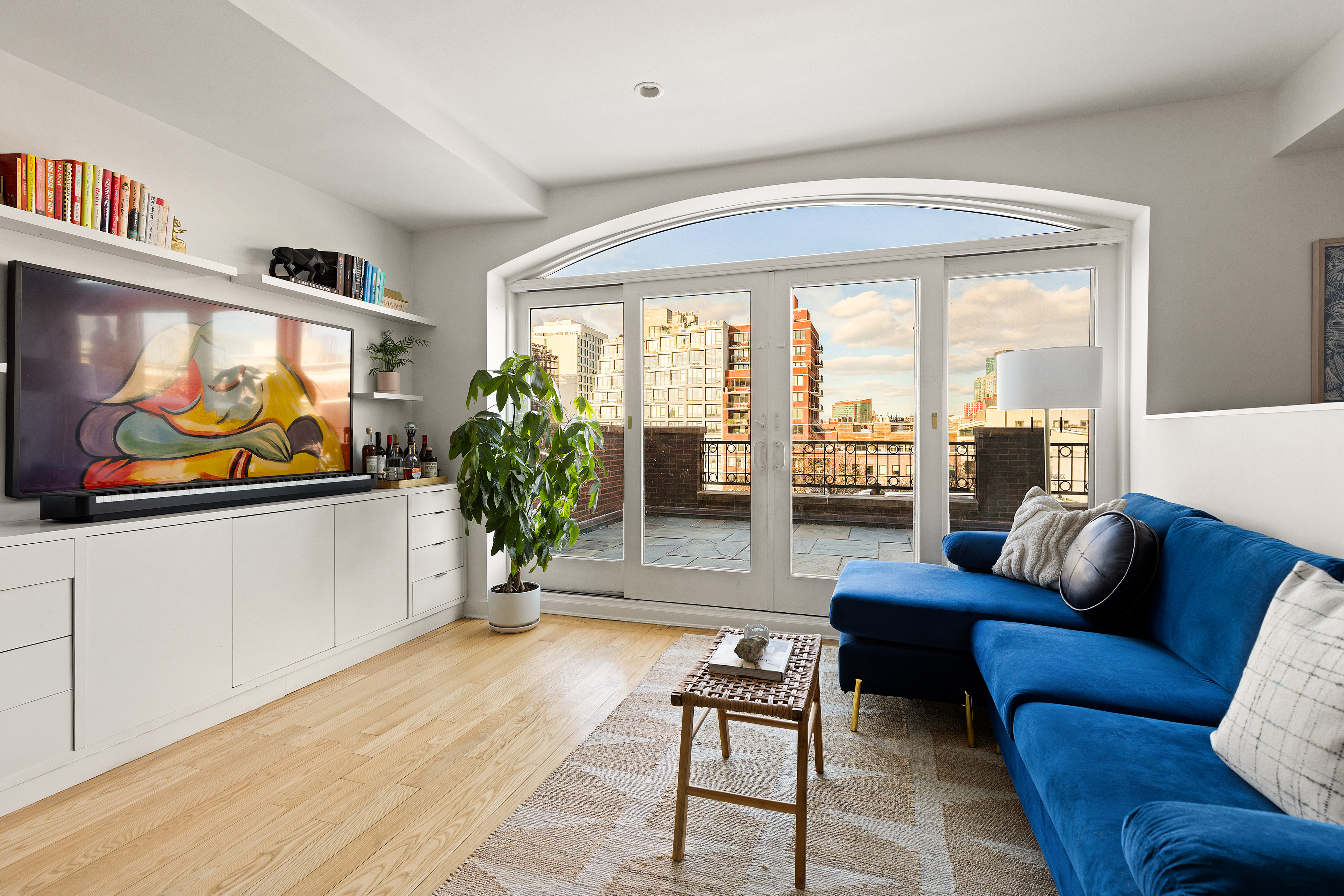 316 2nd Street, Unit 5E Brooklyn, NY 11215 - Photo 3 of 11 a living room with furniture and a flat screen tv