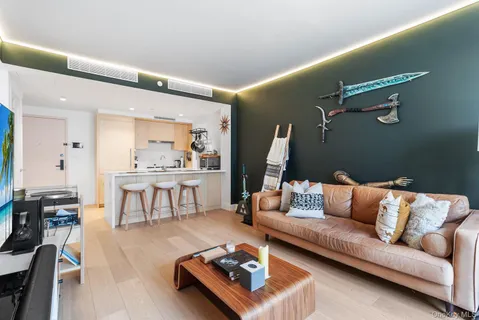 a living room with furniture and a table