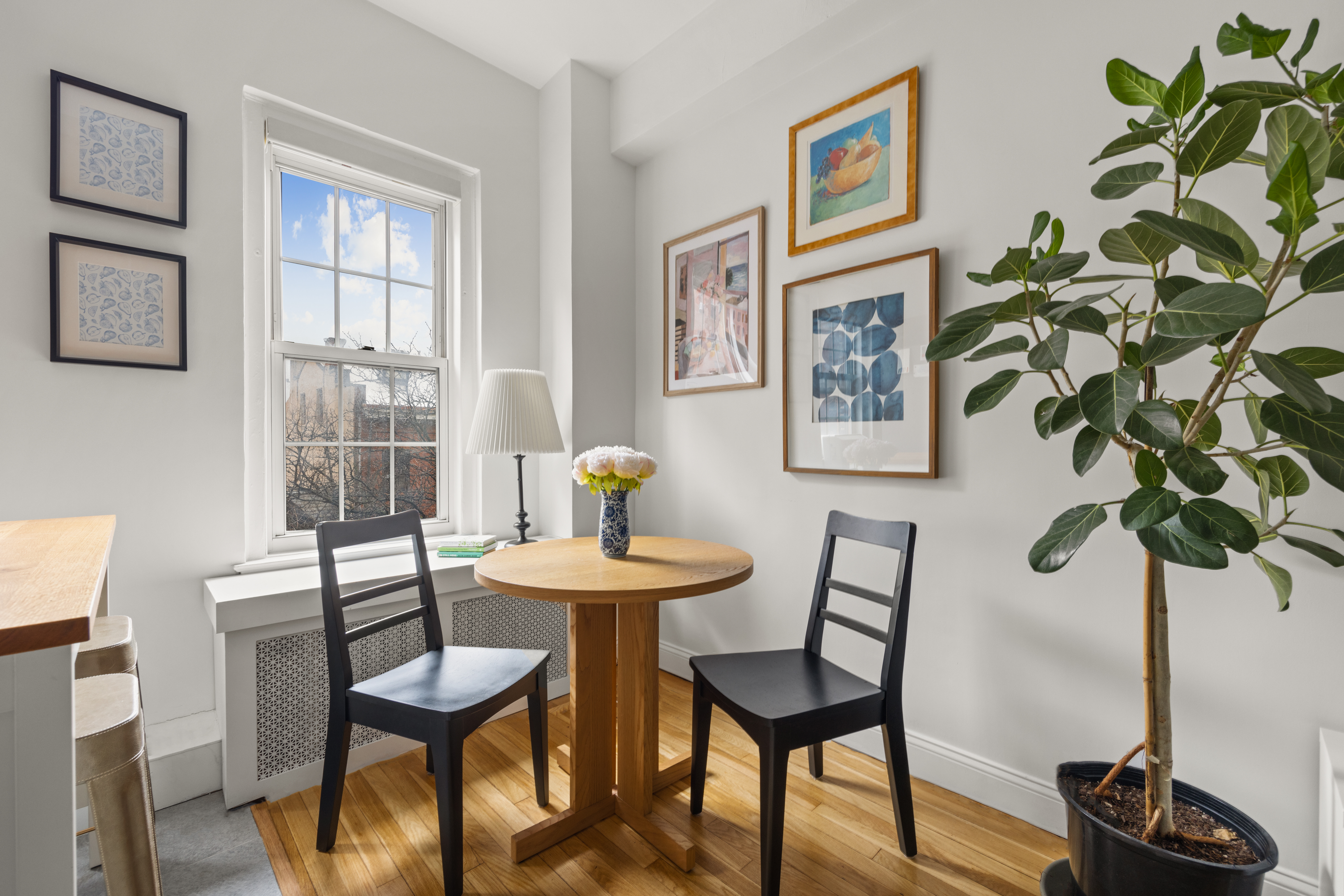 155 Henry Street, Unit 4H Brooklyn, NY 11201 - Photo 5 of 8 a view of a room with furniture and wooden floor