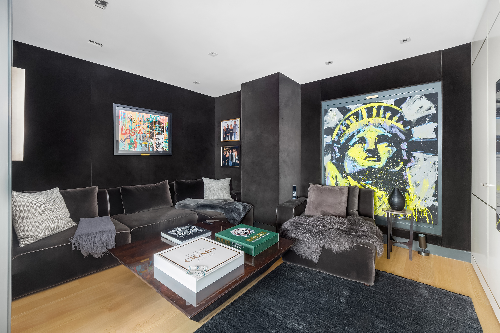 110 Central Park South, Unit 12ABC Manhattan, NY 10019 - Photo 9 of 49 a living room with furniture and a flat screen tv