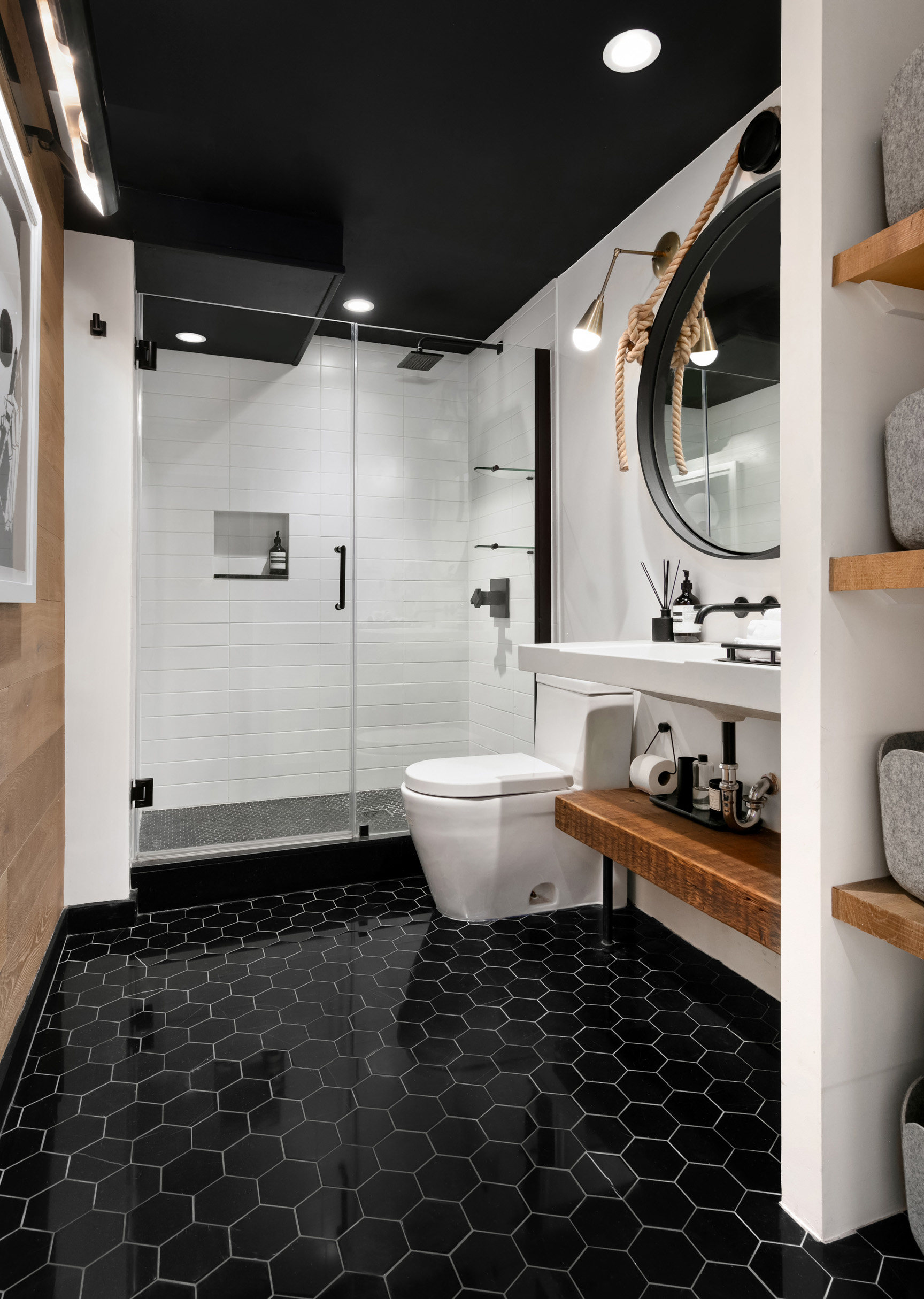 133-131 West 28th Street, Unit 6C Manhattan, NY 10001 - Photo 9 of 10 a bathroom with a toilet sink and mirror