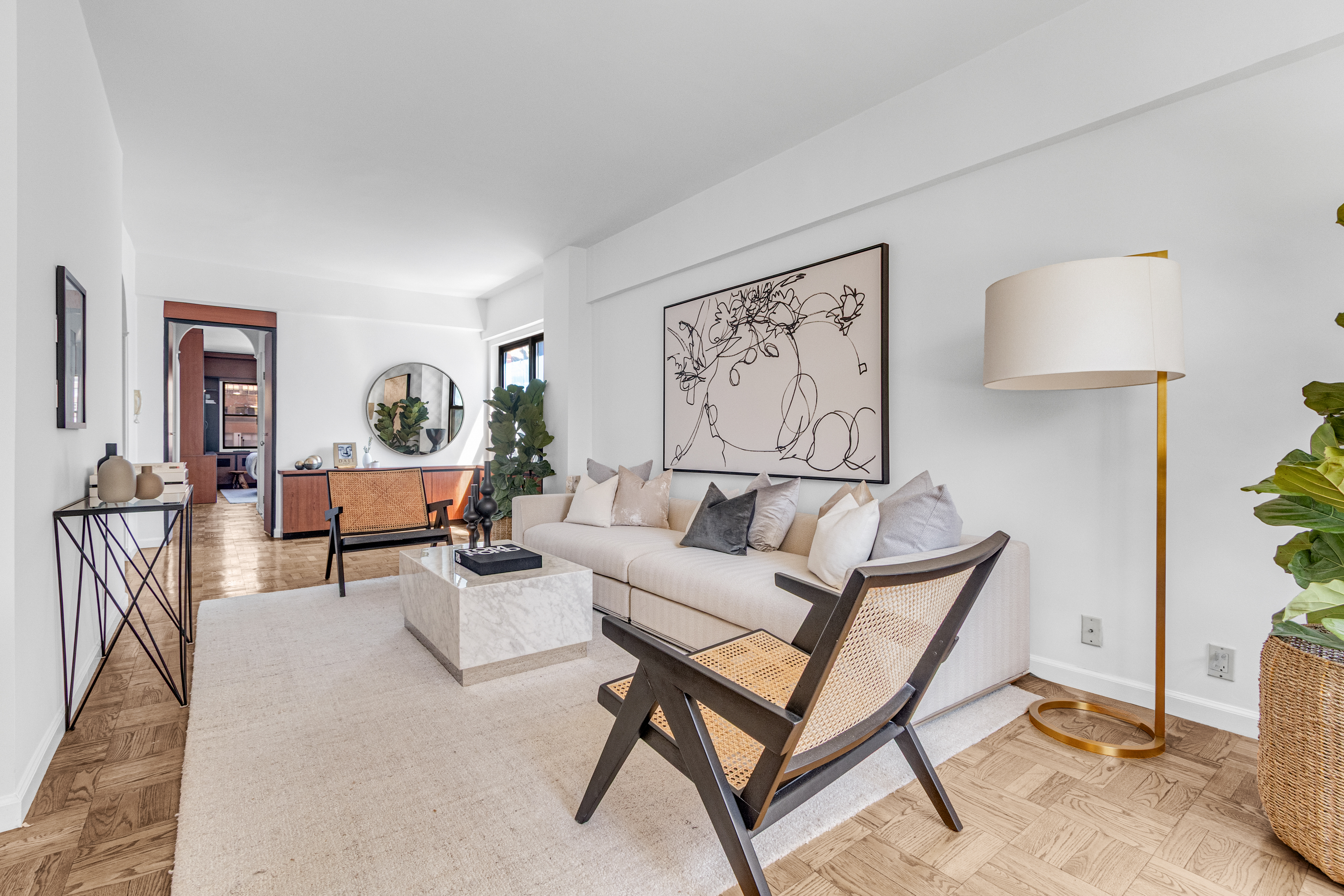 345 East 52nd Street, Unit 10CD Manhattan, NY 10022 - Photo 2 of 14 a living room with furniture and a rug