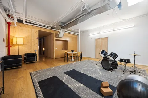 a bathroom with a toilet sink and shower
