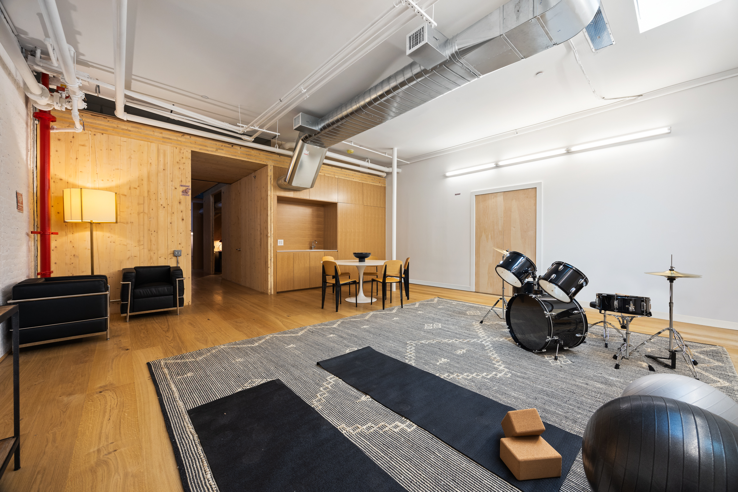 74 Reade Street, Unit 1EAST Manhattan, NY 10007 - Photo 19 of 22 a room with furniture and a wooden floor