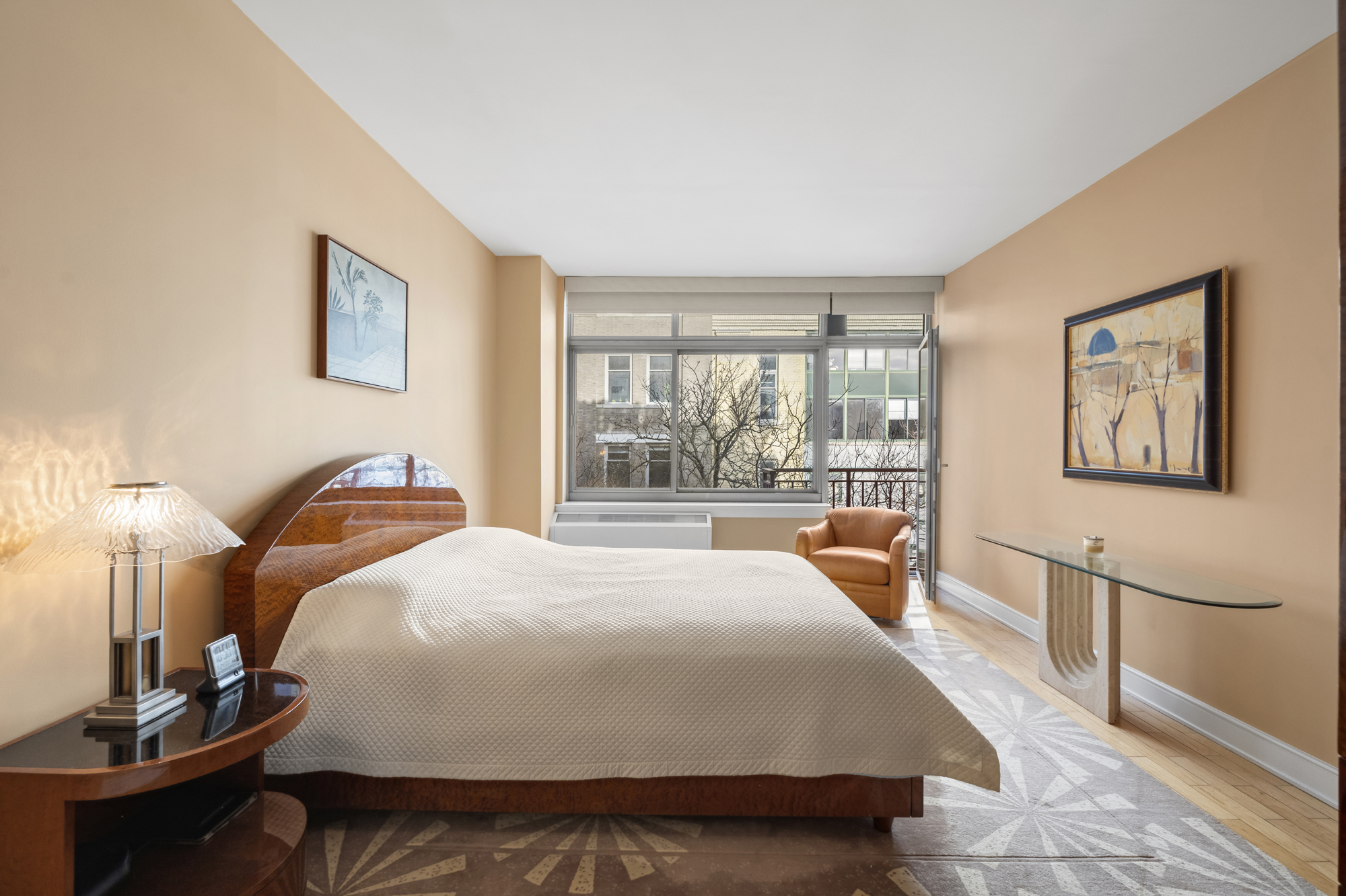 99 Jane Street, Unit 4H Manhattan, NY 10014 - Photo 9 of 22 a bedroom with a large bed and a large window