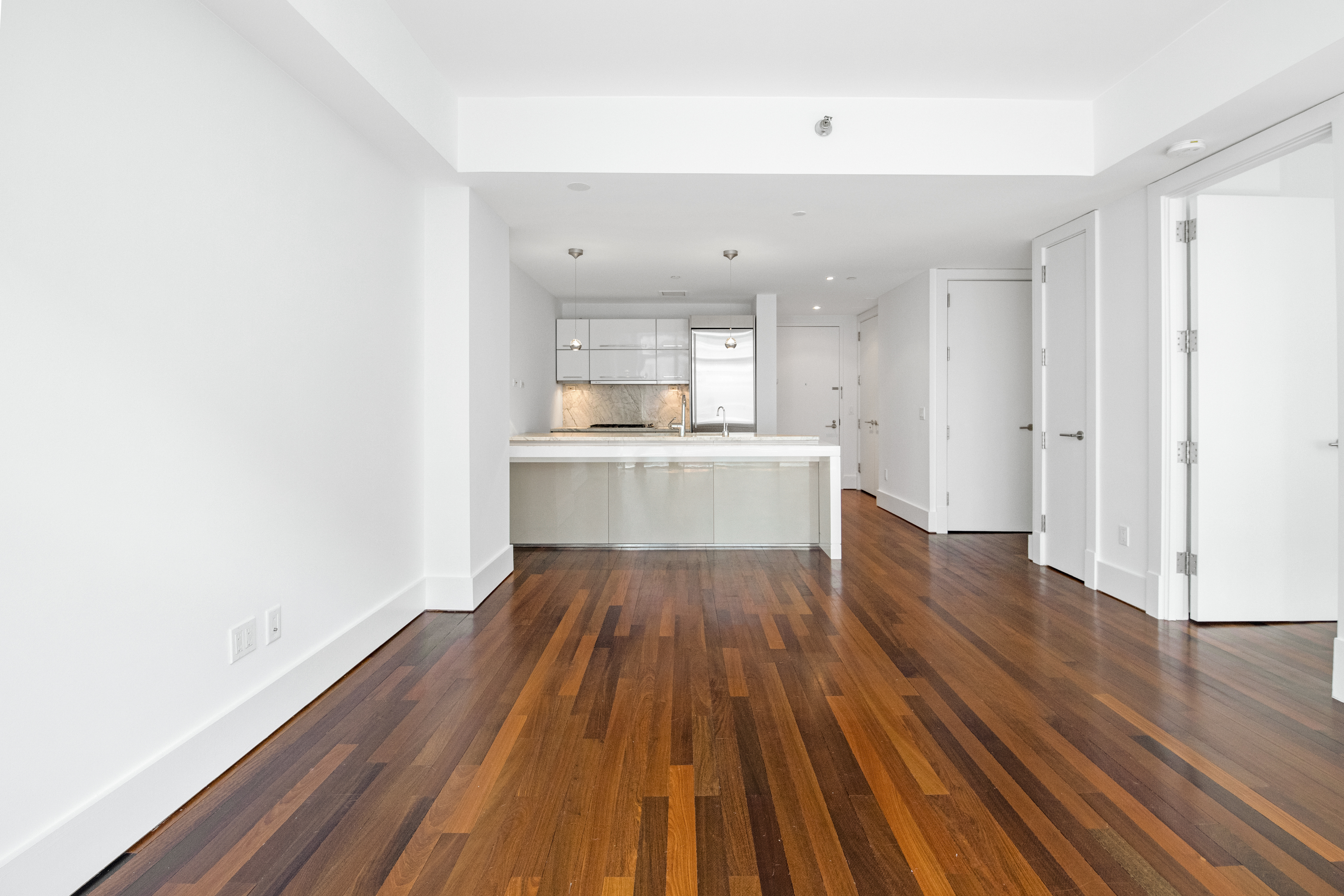 165 West 18th Street, Unit 8B Manhattan, NY 10011 - Photo 2 of 9 a view of kitchen with sink and wooden floor