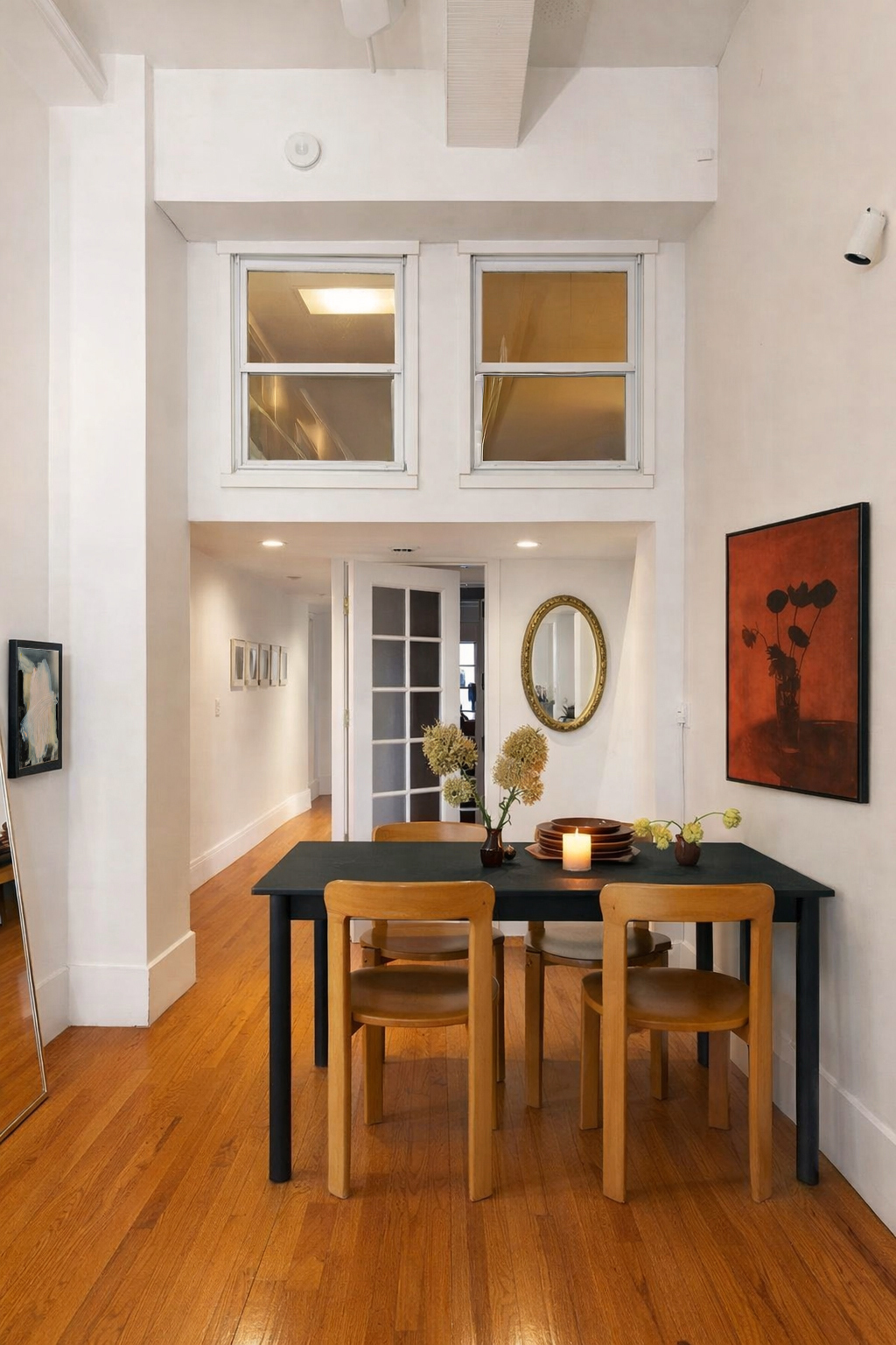 161 West 15th Street, Unit 2D Manhattan, NY 10011 - Photo 3 of 10 a view of a dining room with furniture and wooden floor
