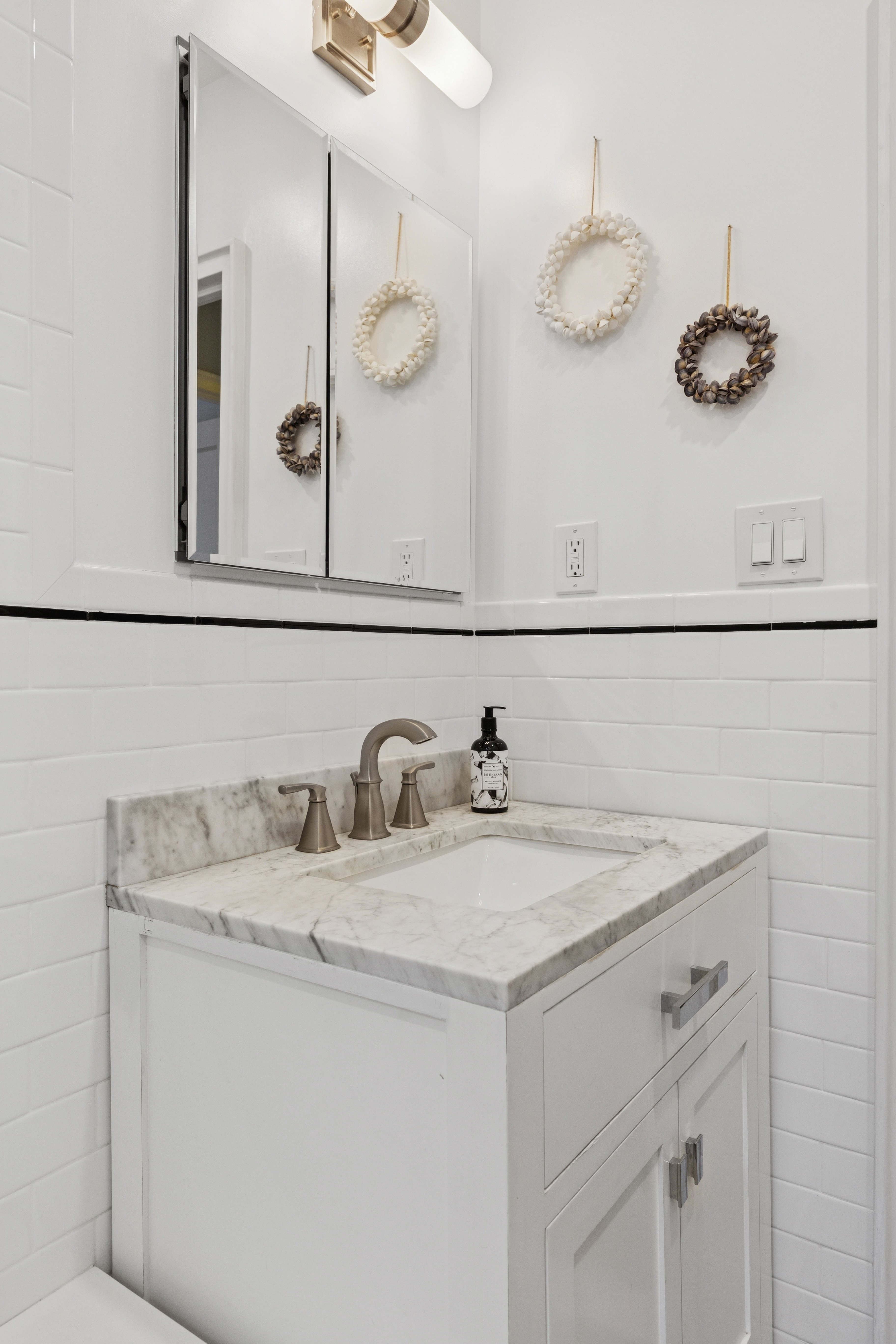 720 Fort Washington Avenue, Unit 5D Manhattan, NY 10040 - Photo 8 of 17 a bathroom with a sink and a mirror