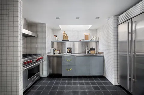 a kitchen with a stove and a refrigerator