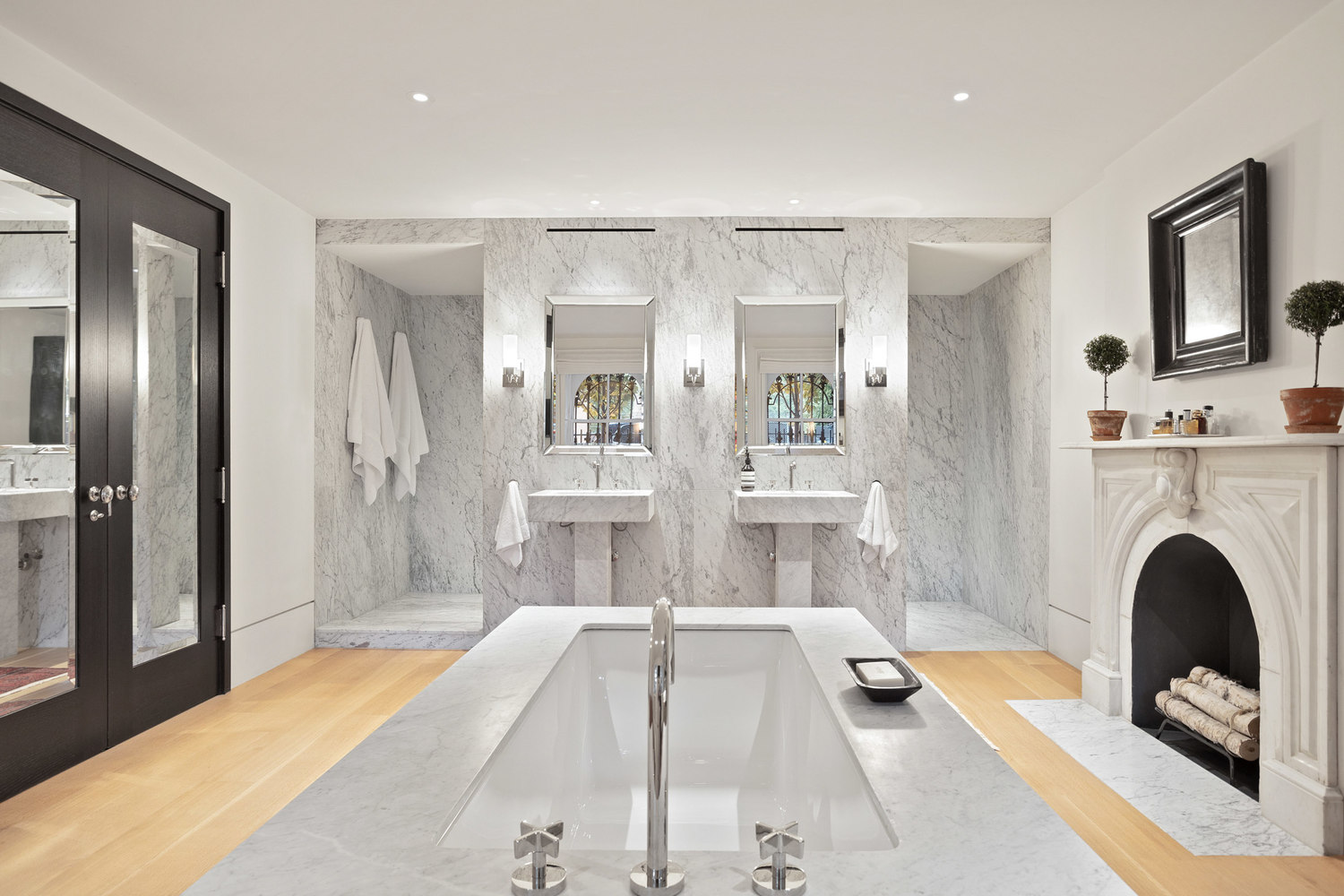 315 Adelphi Street Brooklyn, NY 11205 - Photo 14 of 31 a bedroom with a bed and a fireplace