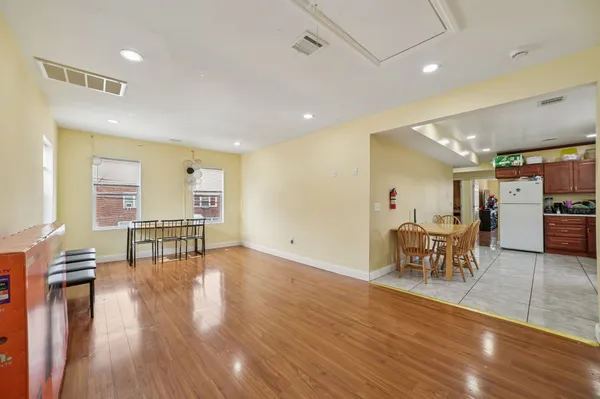 a lobby with furniture and wooden floor