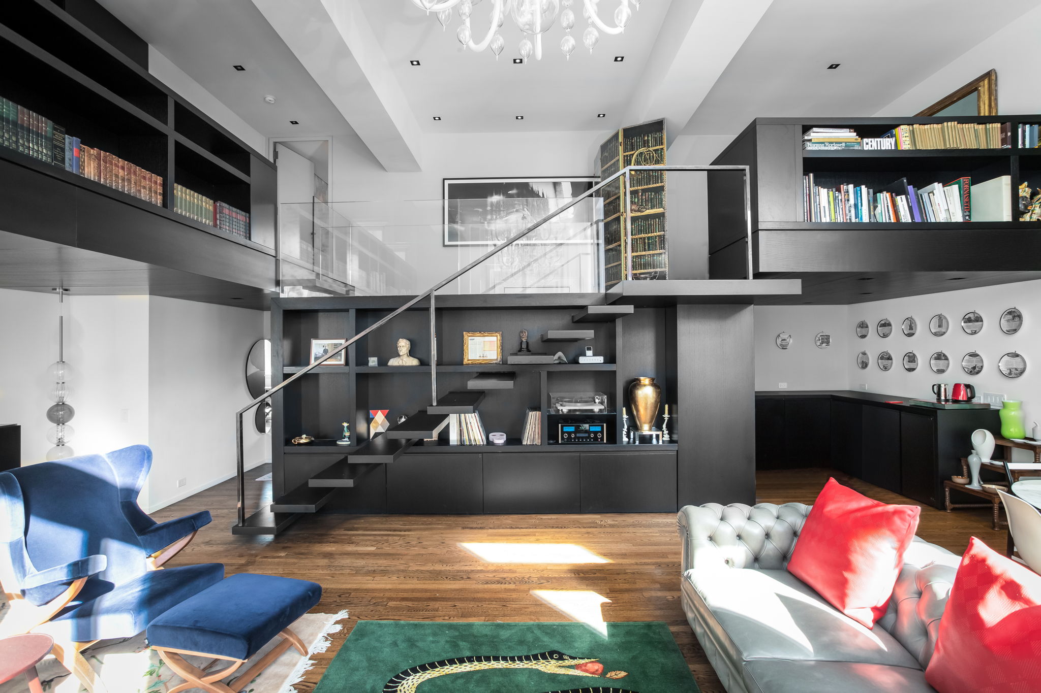 240 Centre Street, Unit 3H Manhattan, NY 10013 - Photo 5 of 20 a living room with furniture a fireplace and a flat screen tv