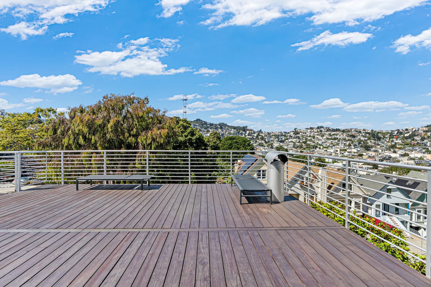 a view of balcony with wooden floor and city view