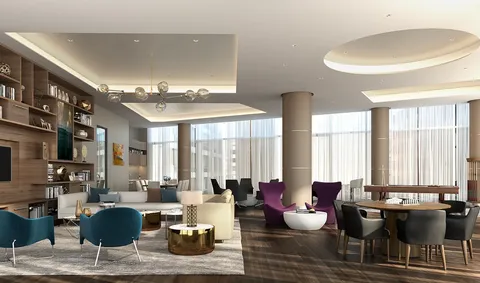 a living room with furniture and large windows