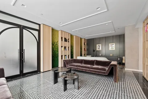 a living room with furniture and a rug