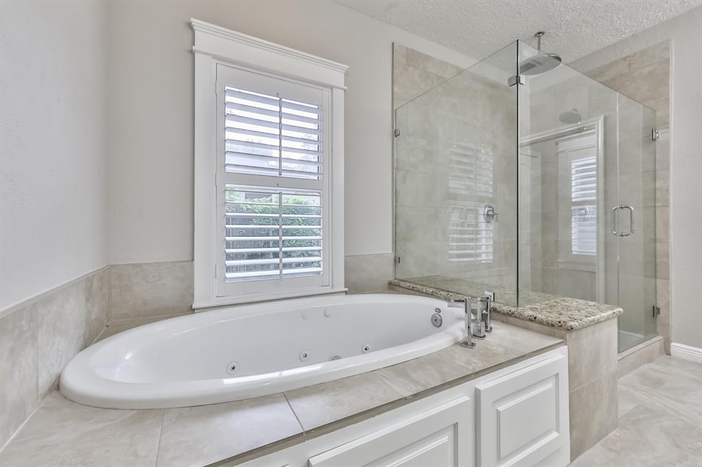 1120 Winston Street Houston, TX 77009 - Photo 24 of 29 a white bath tub sitting next to a shower
