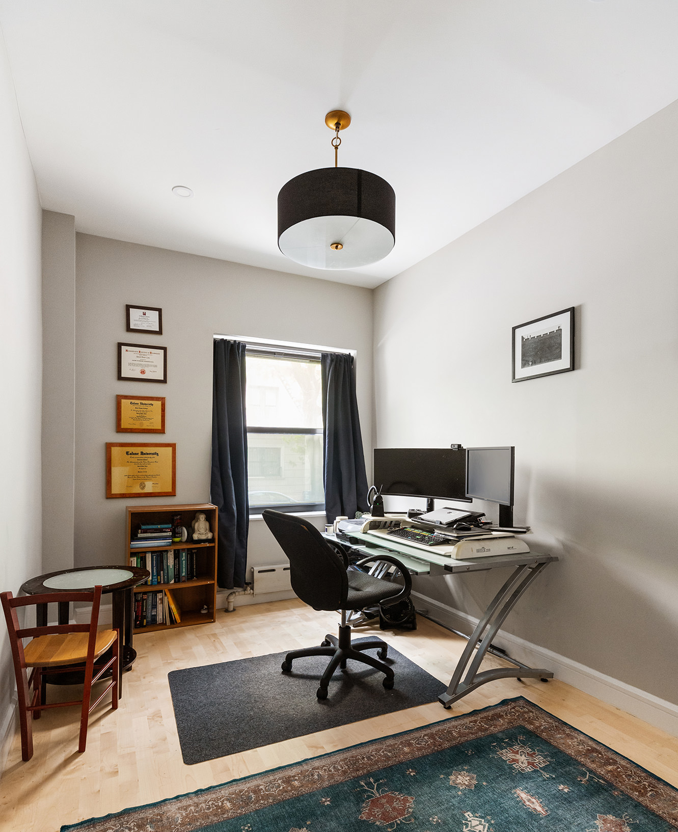 330 East 94th Street, Unit 1AB Manhattan, NY 10128 - Photo 8 of 14 a work room with furniture and window