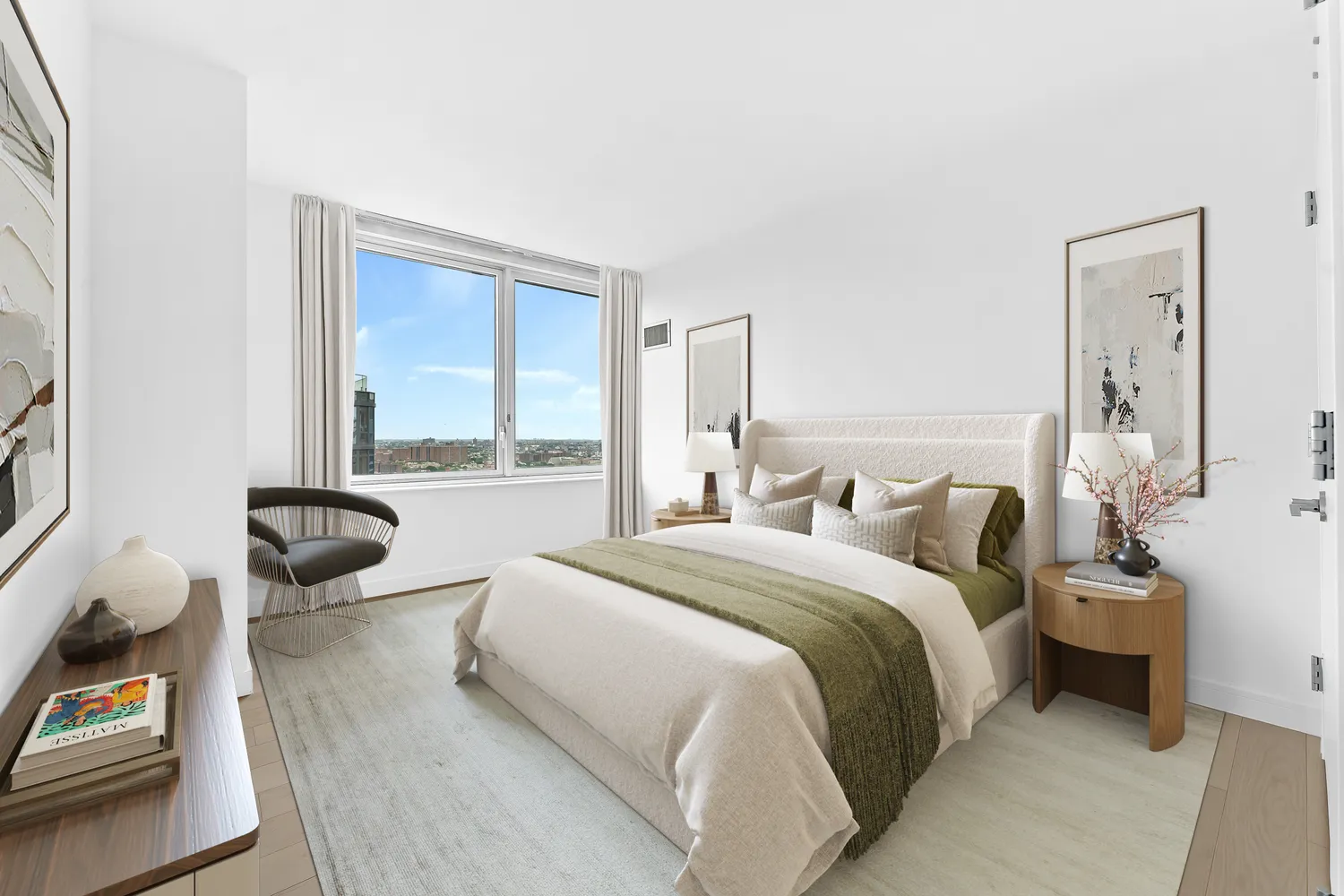 a bedroom with a bed and large windows