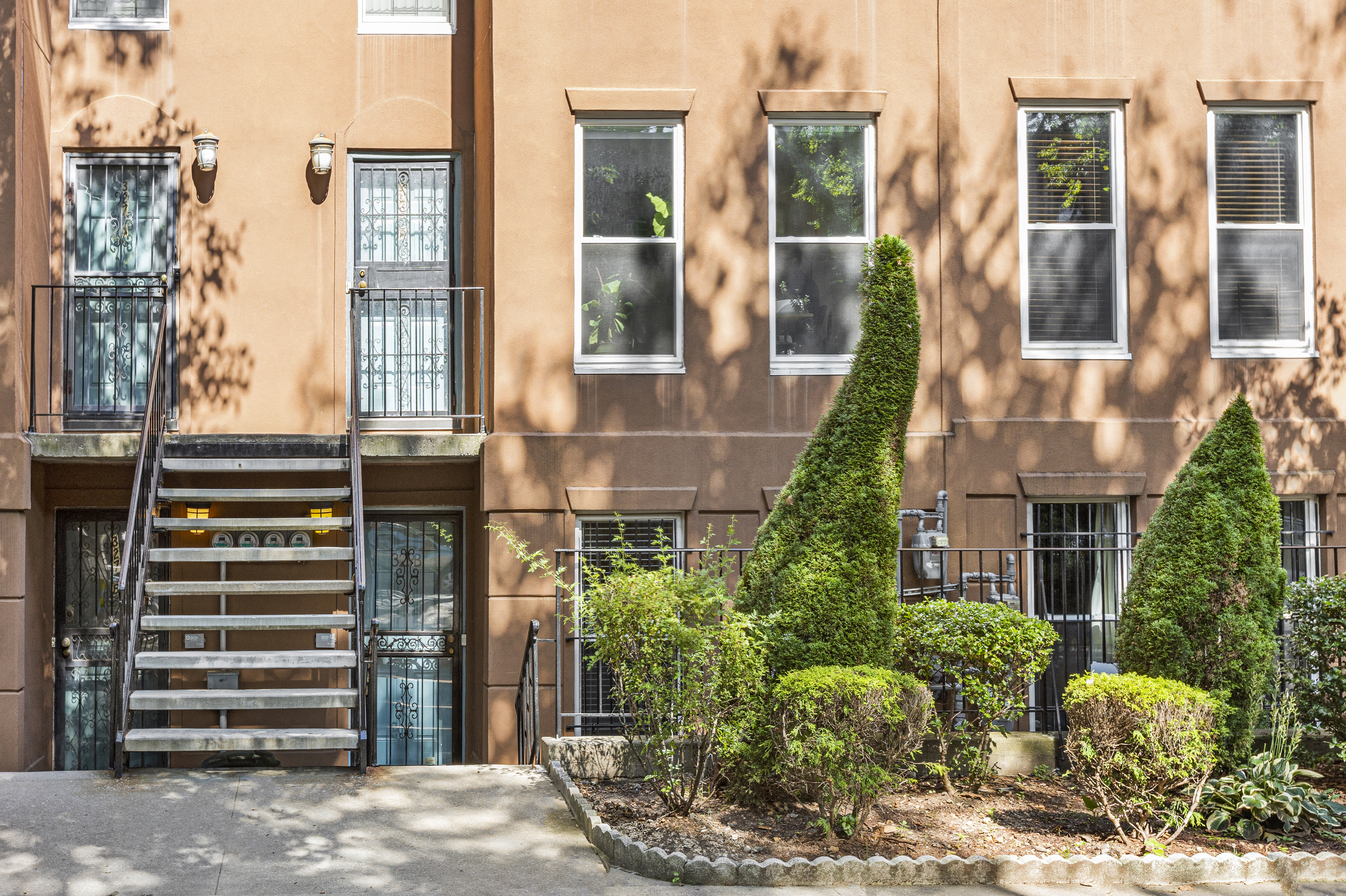 329 Grand Avenue, Unit B Brooklyn, NY 11238 - Photo 7 of 9 a view of a building with a garden and plants