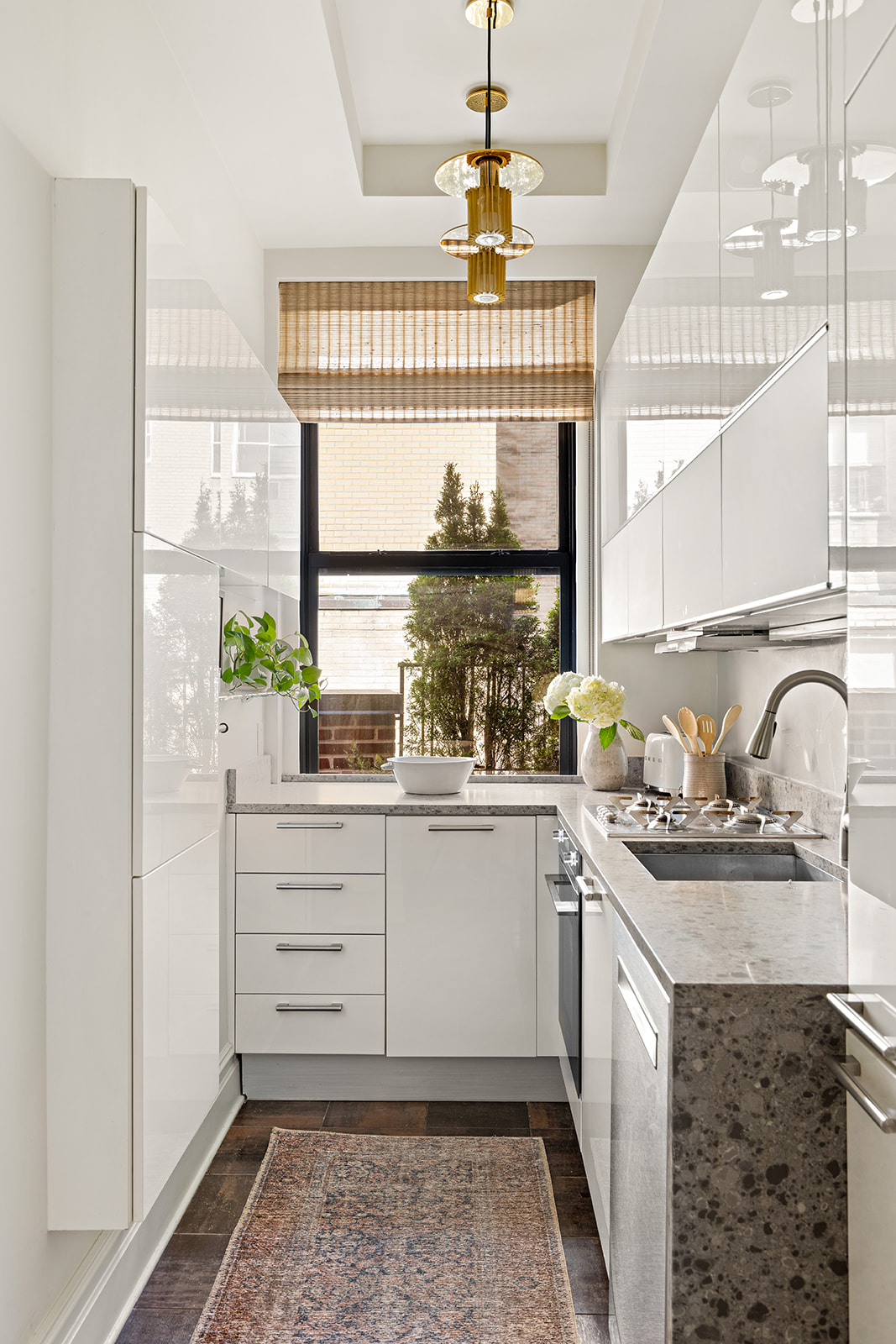 151 East 83rd Street, Unit PHB Manhattan, NY 10028 - Photo 6 of 11 a kitchen with stainless steel appliances granite countertop a sink and cabinets