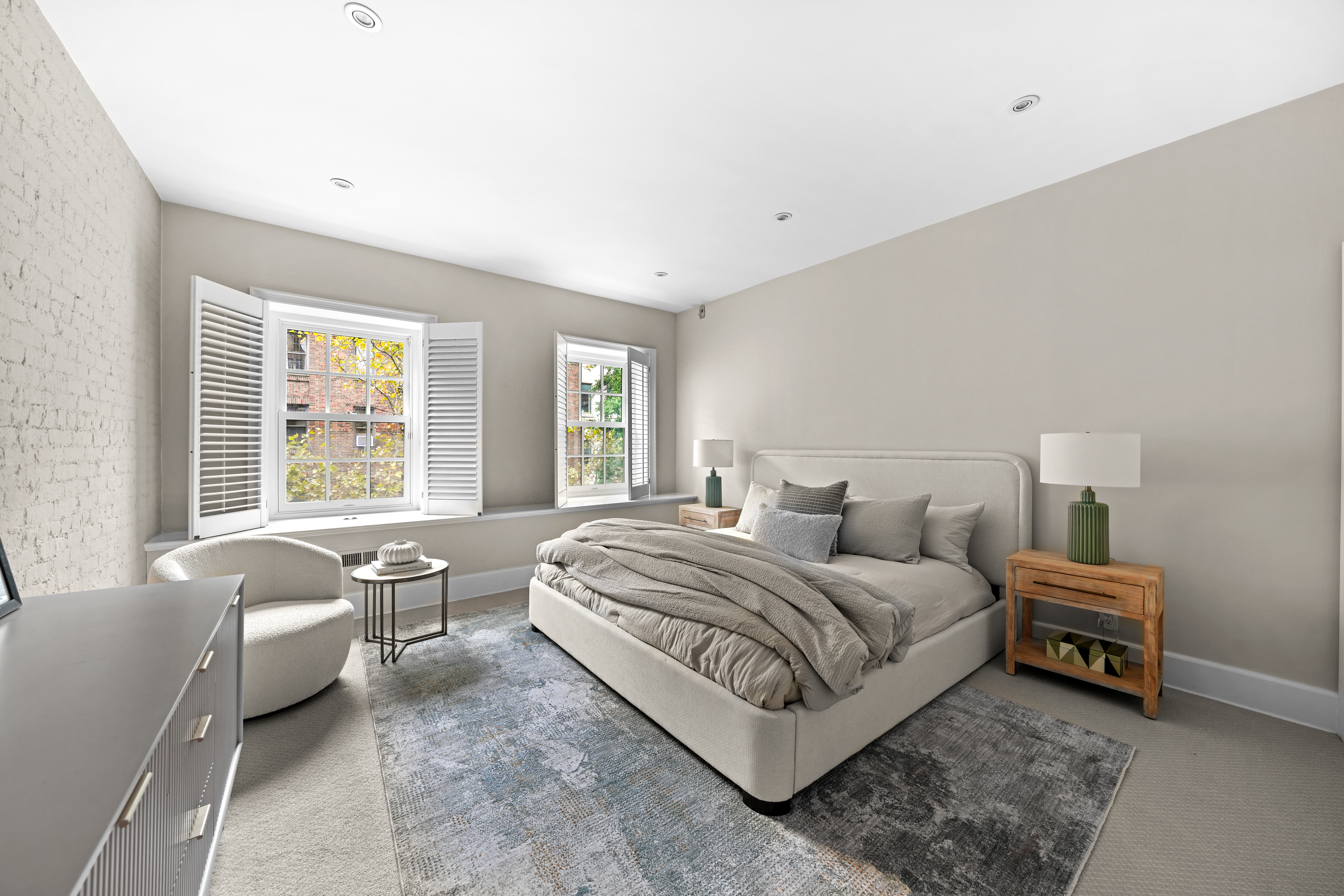 247 East 71st Street Manhattan, NY 10021 - Photo 19 of 31 a bedroom with bed and a large window