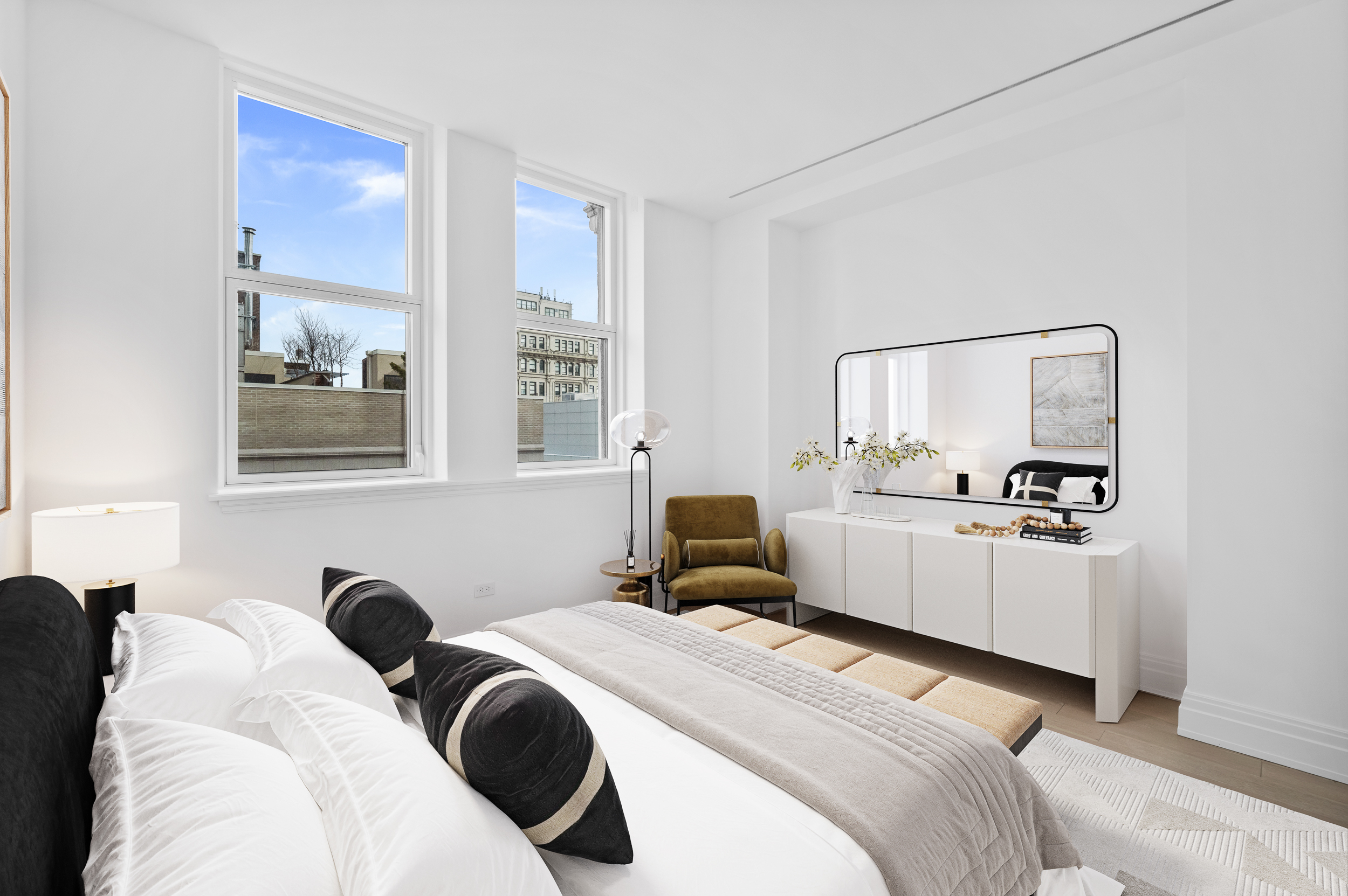 108 Leonard Street, Unit 12F Manhattan, NY 10013 - Photo 6 of 15 a bedroom with a white bed and dresser