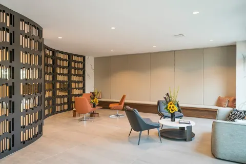 a living room with furniture pool table and a flat screen tv