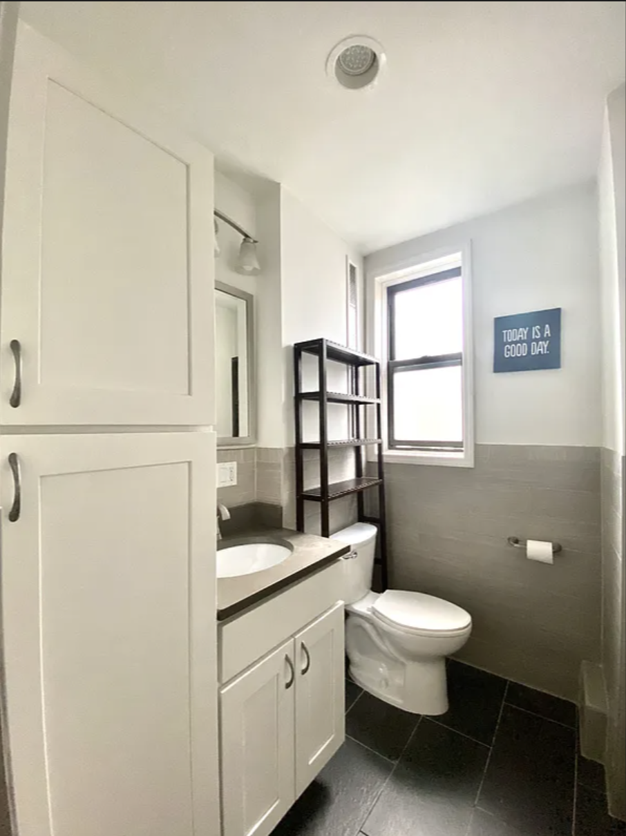 567 6th Street, Unit 10 Brooklyn, NY 11215 - Photo 5 of 14 a bathroom with a toilet a sink and a window