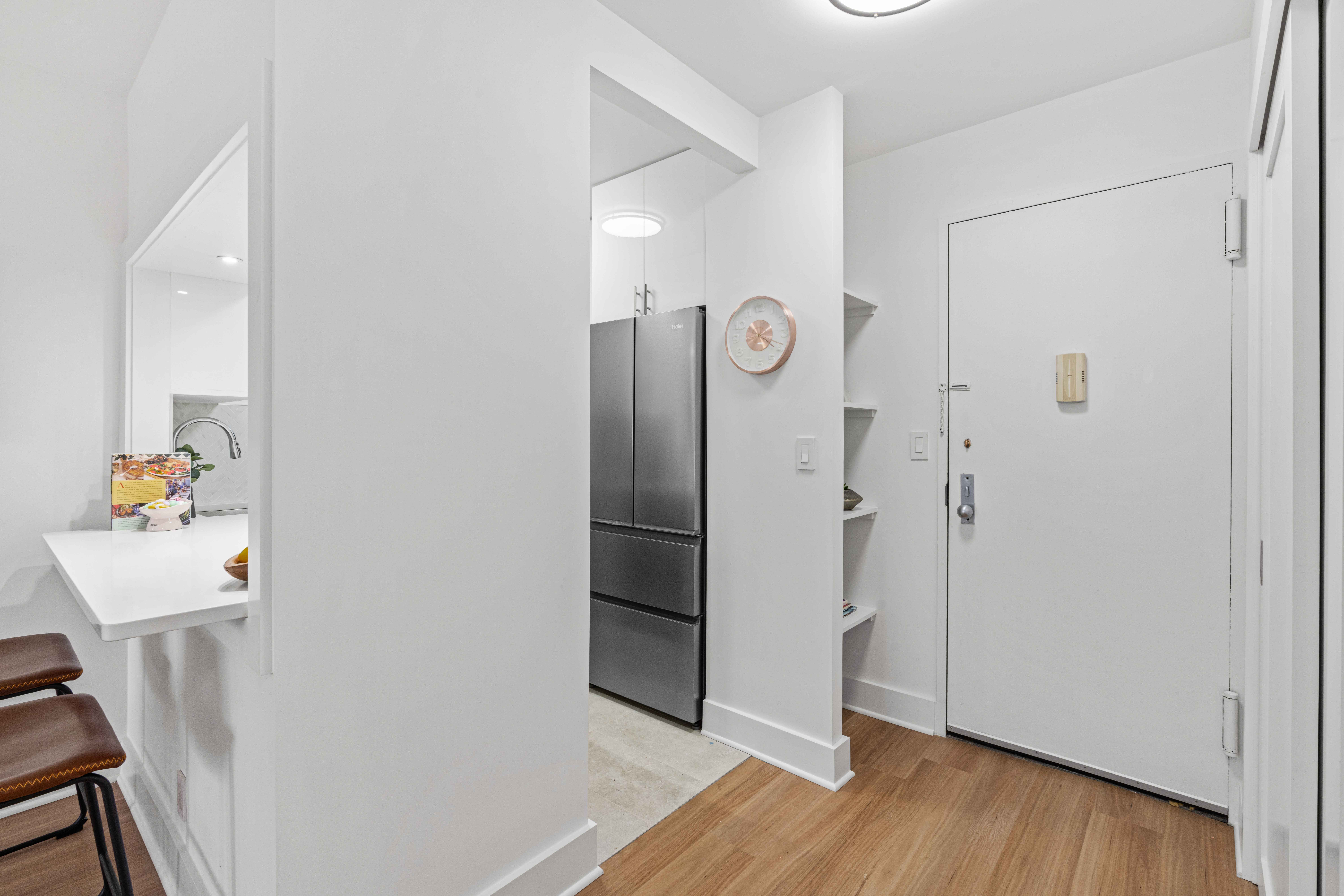 400 East 54th Street, Unit 22D Manhattan, NY 10022 - Photo 6 of 21 a view of a hallway with wooden floor