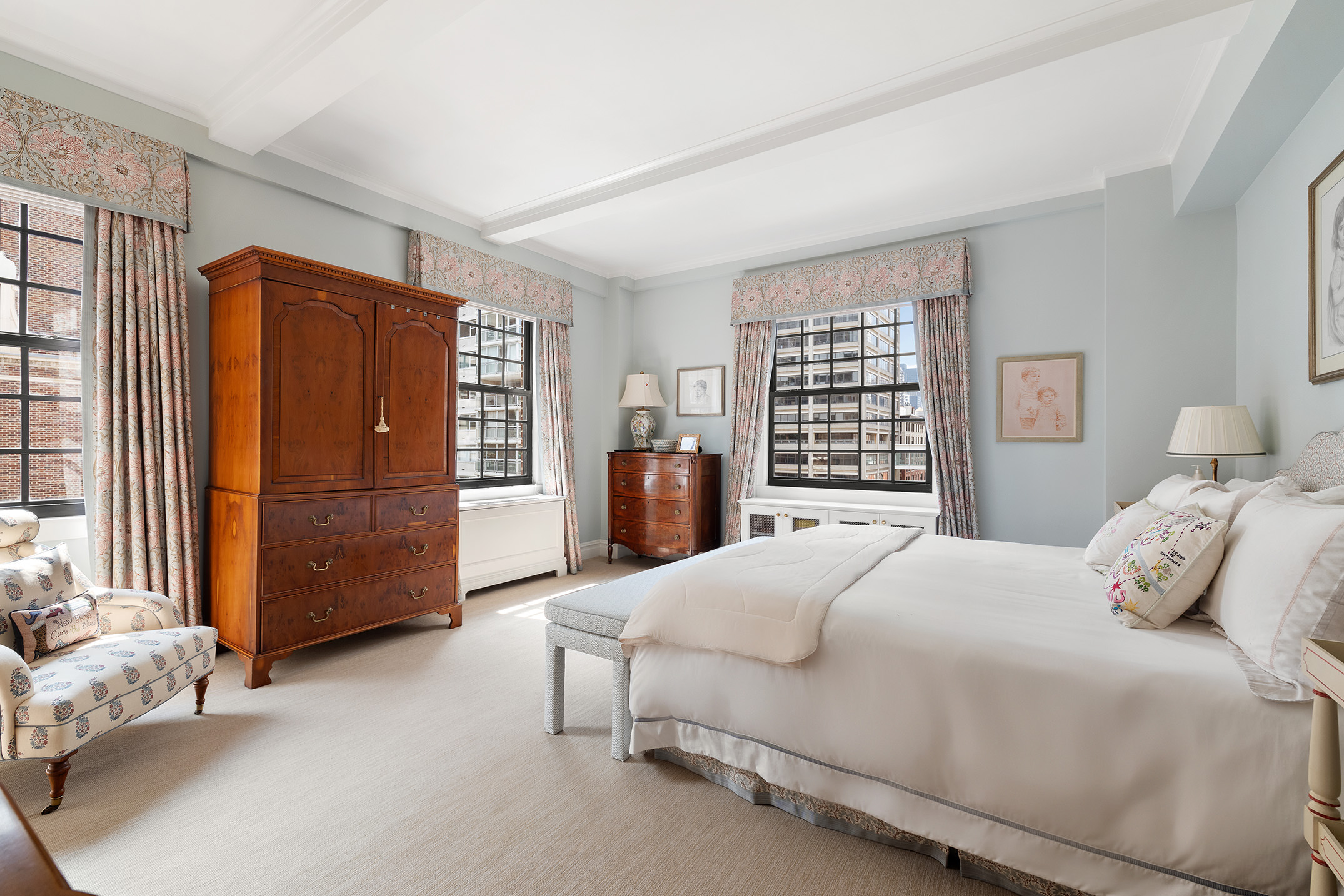 129 East 69th Street, Unit 8/9A Manhattan, NY 10021 - Photo 7 of 16 a bedroom with a bed closet and a window