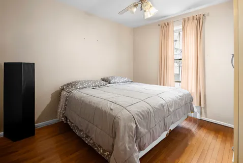 a bedroom with a bed and a window