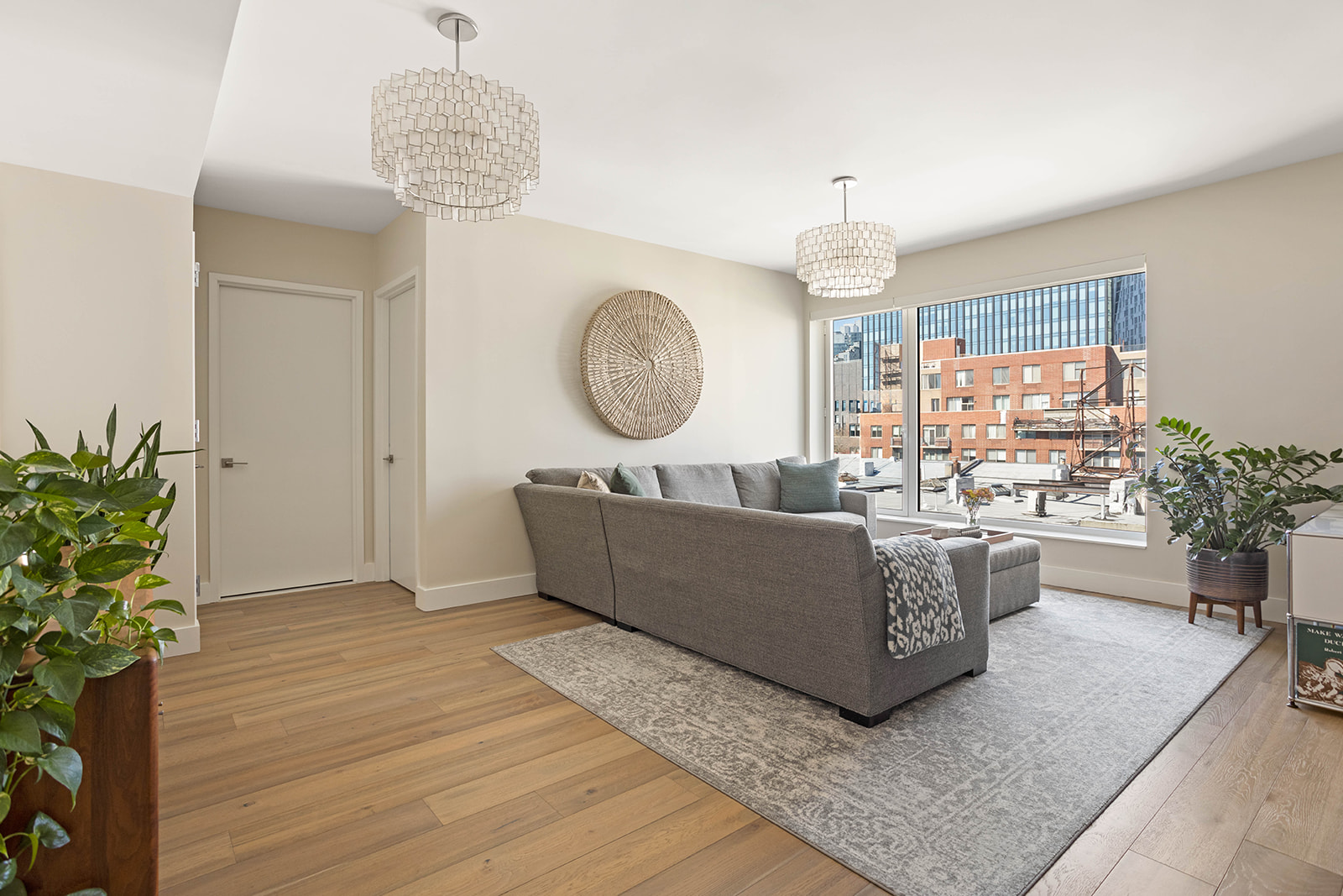 561 Pacific Street, Unit 606 Brooklyn, NY 11217 - Photo 5 of 17 a living room with furniture and a chandelier