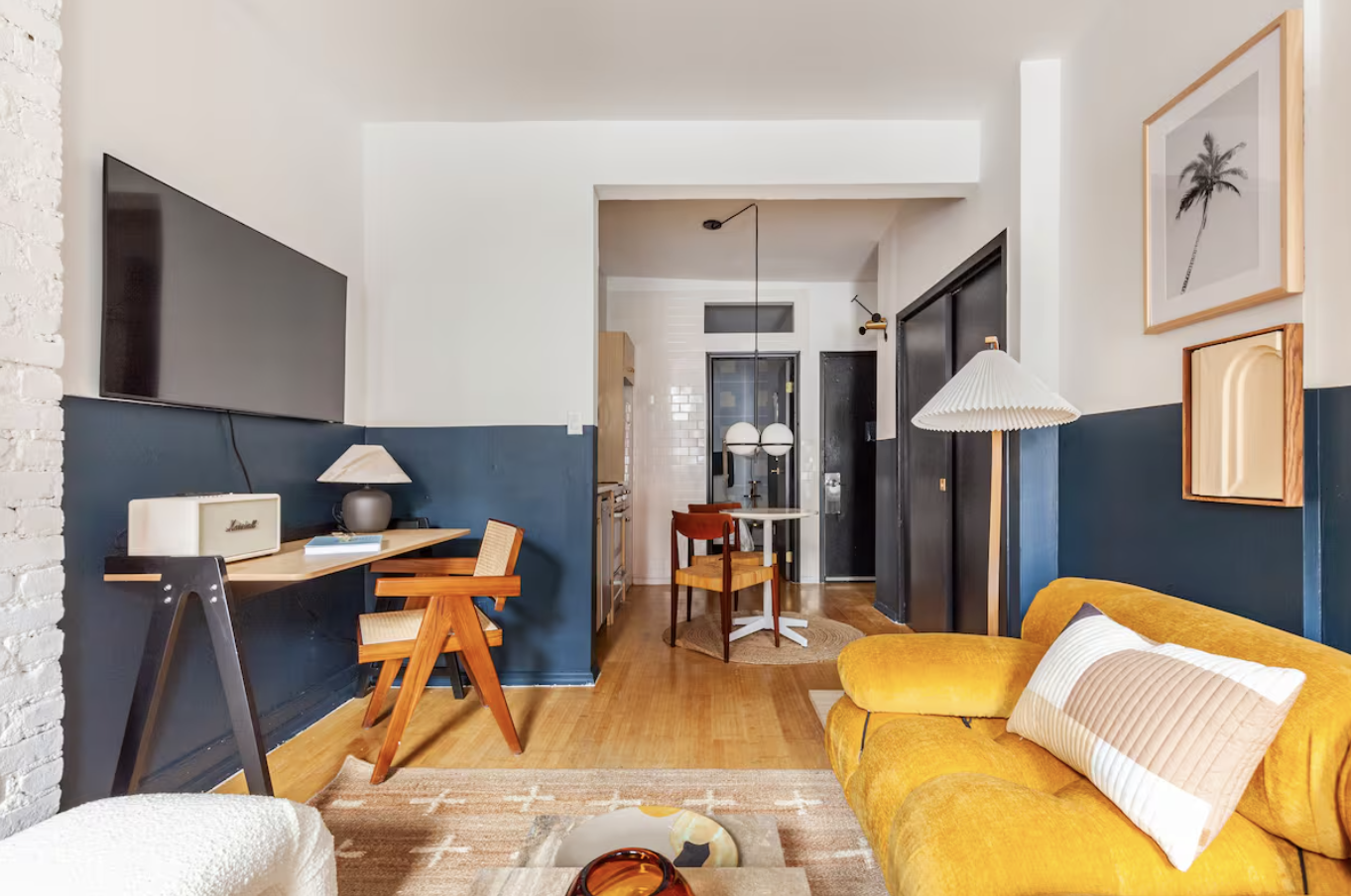 240 Mulberry Street, Unit 2 Manhattan, NY 10012 - Photo 6 of 19 a living room with furniture and a lamp