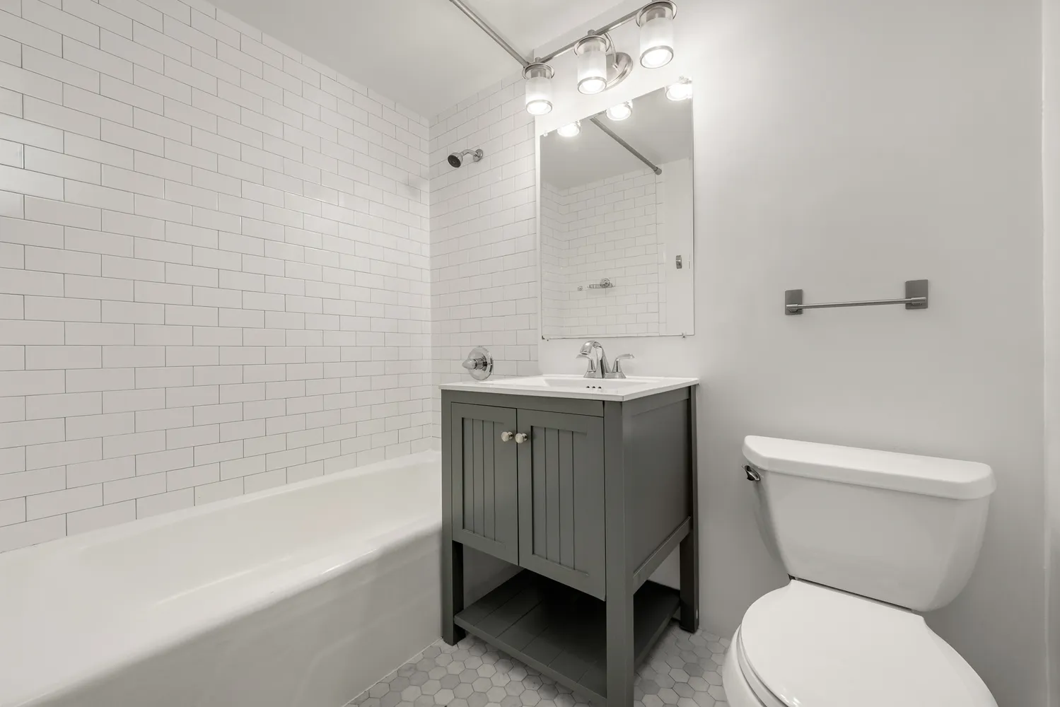 a bathroom with a toilet a sink and bathtub