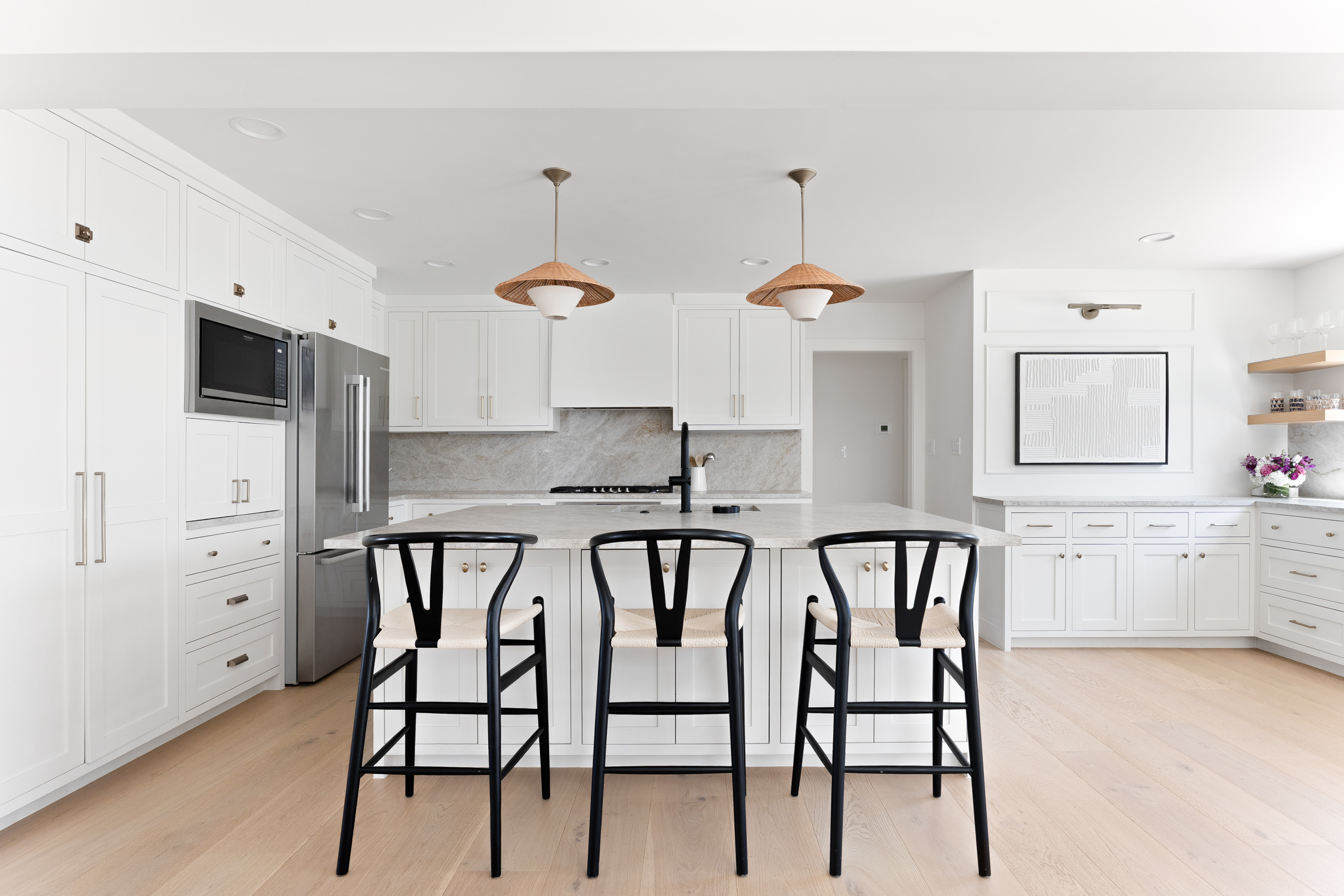 1317 Thaddeus Cove Austin, TX 78746 - Photo 7 of 22 a kitchen with stainless steel appliances a dining table chairs sink and cabinets