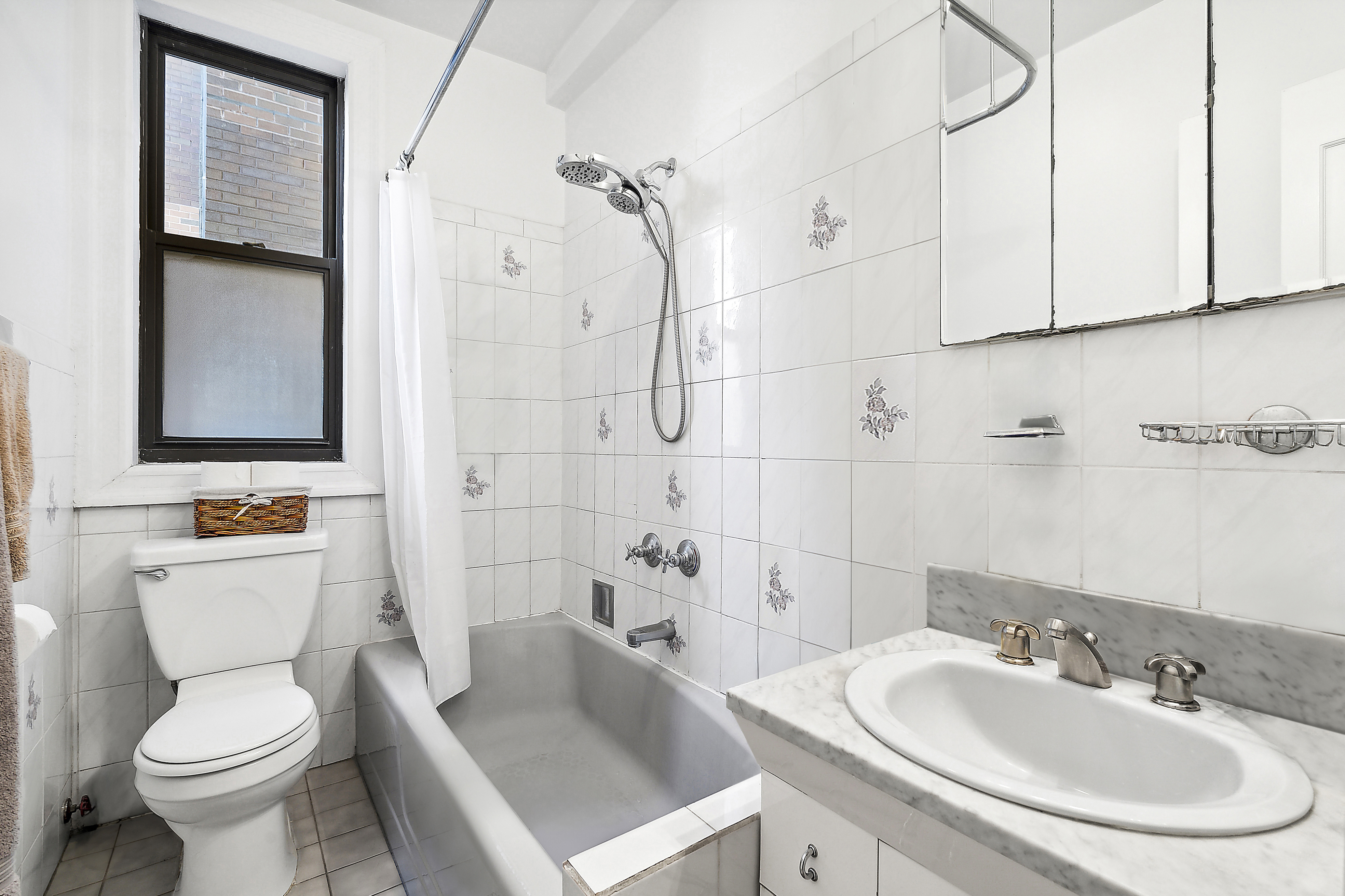 395 Riverside Drive, Unit 5F Manhattan, NY 10025 - Photo 6 of 8 a bathroom with a sink toilet and shower