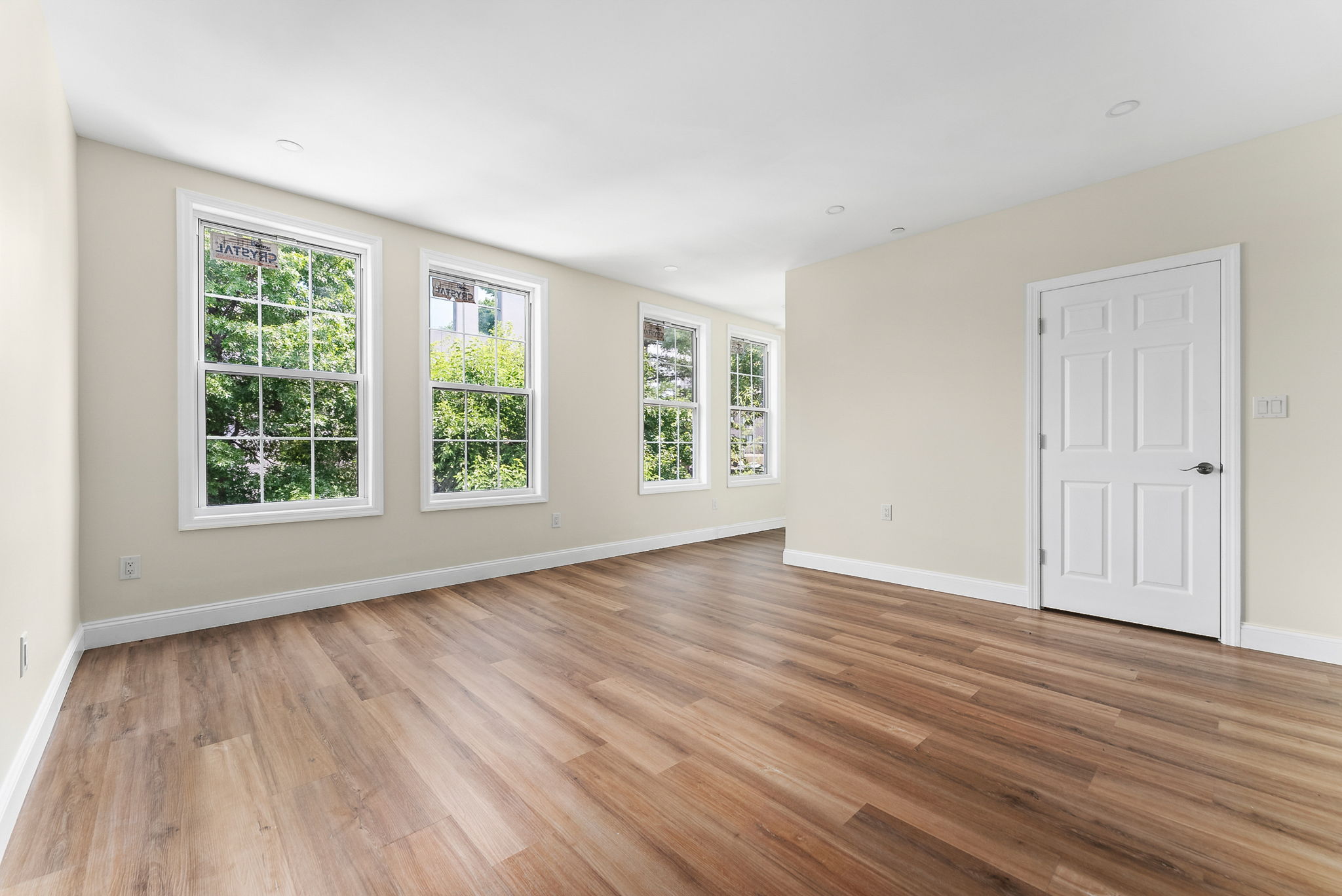 217 Butler Street, Unit 2 Brooklyn, NY 11217 - Photo 5 of 15 a view of an empty room with wooden floor and a window