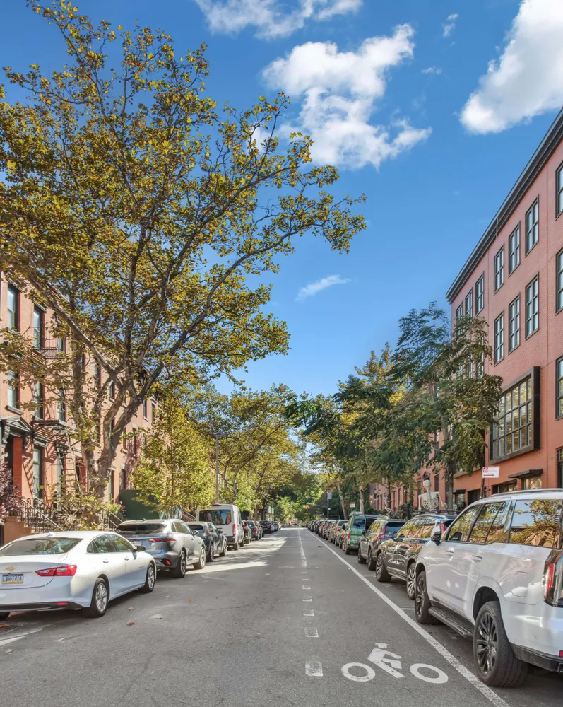 a view of car parked on the roadside