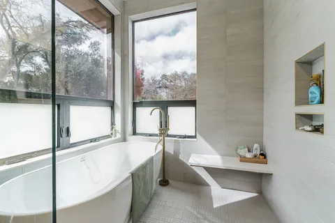 a bathroom with a bathtub and a sink