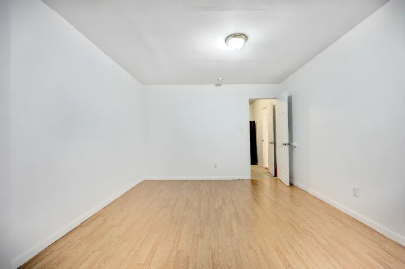 255 Covert Street Brooklyn, NY 11207 - Photo 14 of 18 wooden floor in a hall with an entryway