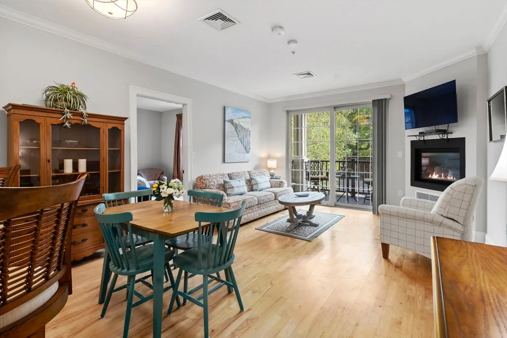 a living room with fireplace furniture and a flat screen tv