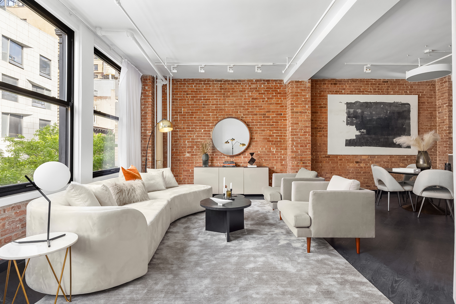 36 West 15th Street, Unit 4 Manhattan, NY 10011 - Photo 2 of 21 a living room with furniture a rug and a large window
