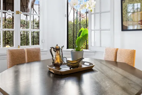 a kitchen with white cabinets and appliances